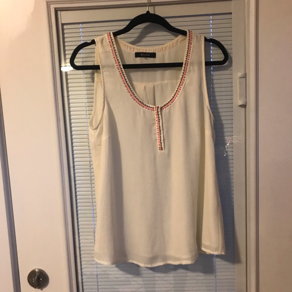 Cream sleeveless blouse